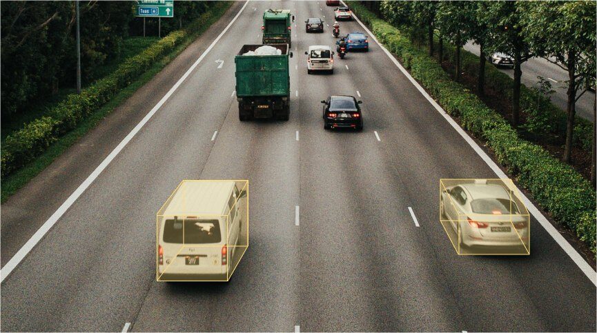Aerial highway scene with 3D bounding boxes on vehicles